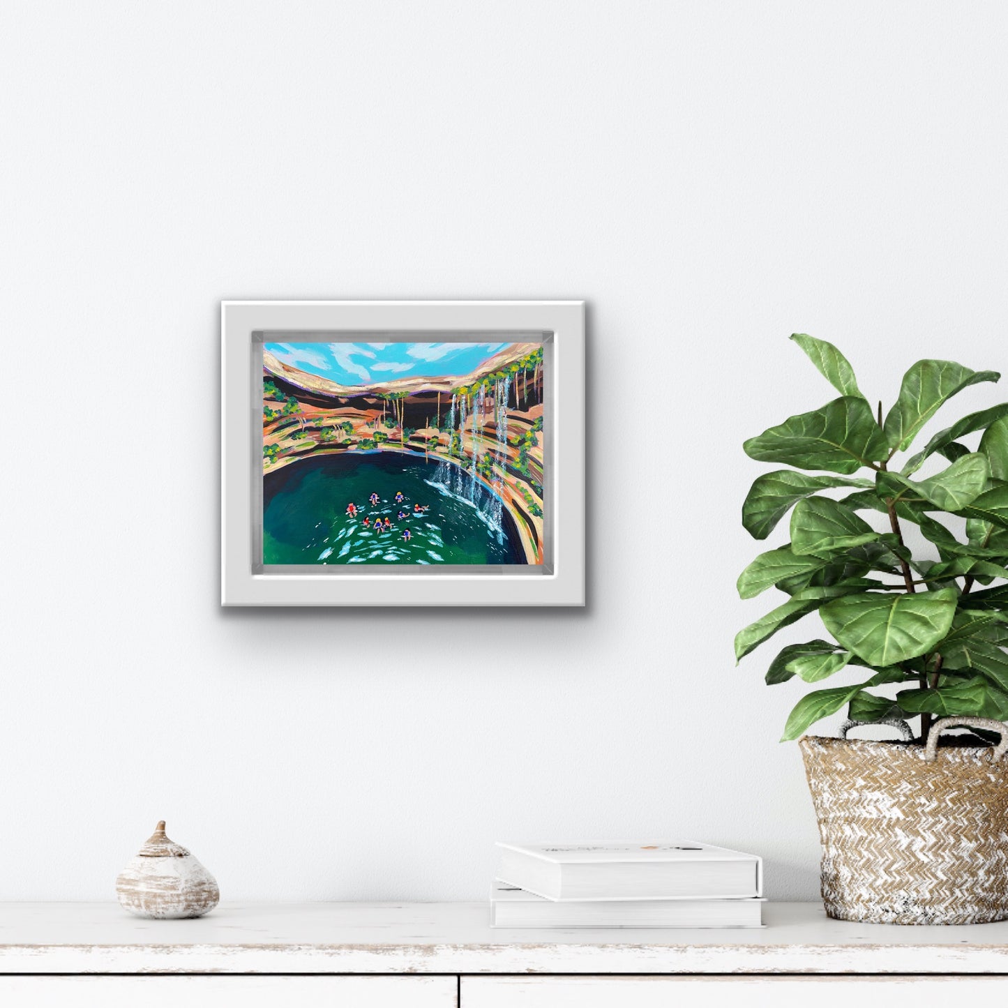 Boston Latinx Travel Artist Alexandra Wuyke Art "Cenote" hangs on a white wall.