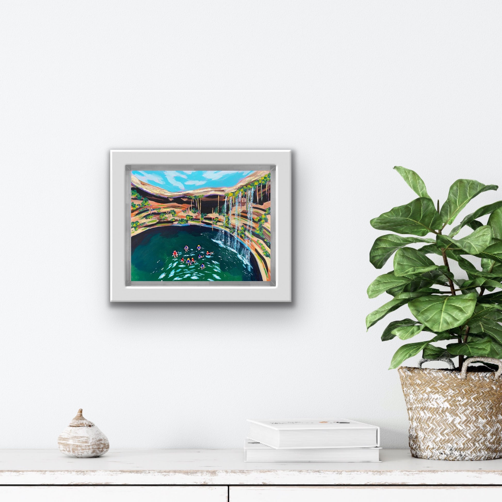 Boston Latinx Travel Artist Alexandra Wuyke Art "Cenote" hangs on a white wall.