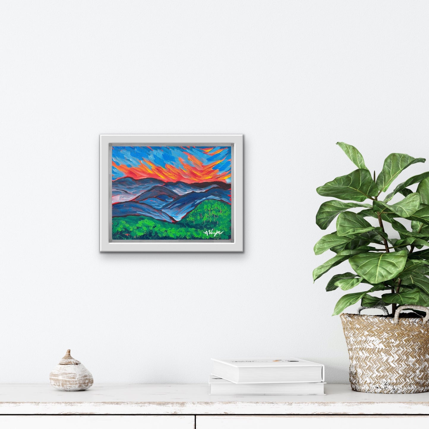 Travel Artwork By Boston Artist Alexandra Wuyke "Smoky Mountains NP" hangs over a fireplace in a living room.