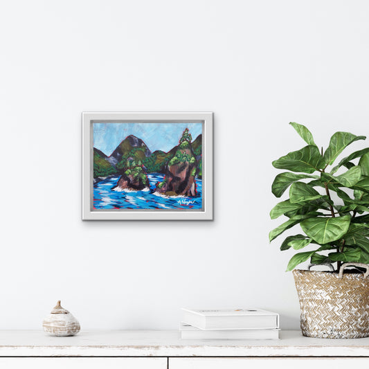 Travel Artwork By Boston Artist Alexandra Wuyke "Kenai Fjords NP" hangs over a fireplace in a living room.