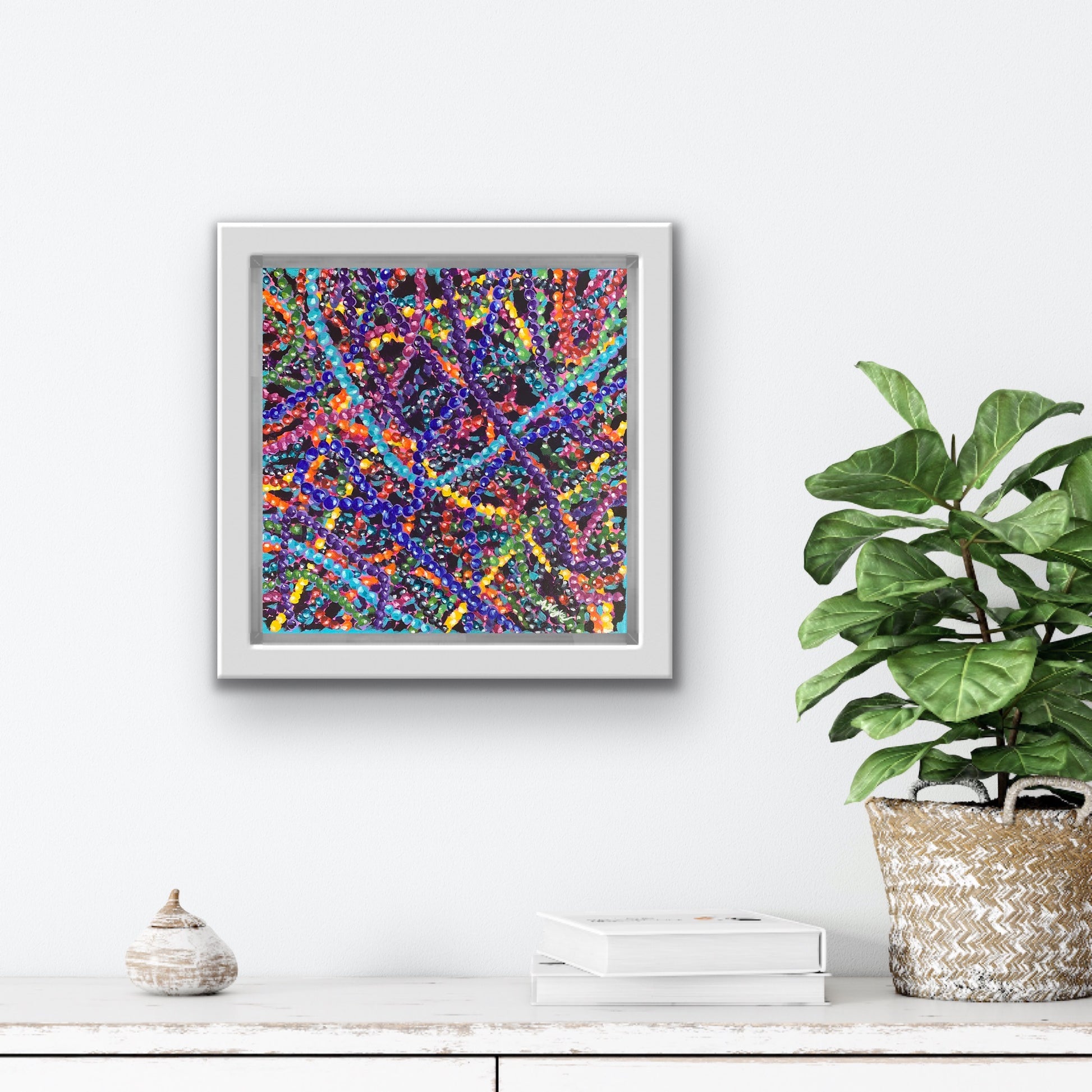Travel Art By Alexandra Wuyke Art original painting "Bunches of Beads" hangs over a fireplace in a living room.